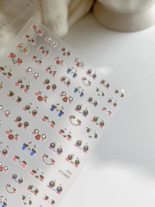 Detailed view of cute cartoon nail stickers featuring diverse facial expressions for DIY
