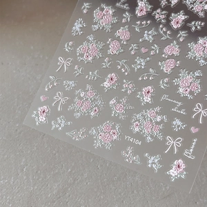 Self-adhesive 3D embossed floral nail stickers featuring pink flowers and butterfly bows