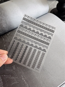 Detail of YT4121 black lace nail art stickers with intricate wave and geometric patterns
