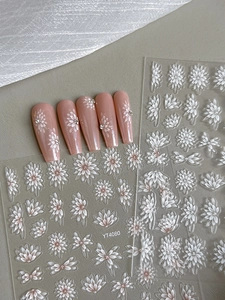 Detail view of YT4080 nail art stickers with white daisies and rhinestone flower patterns