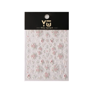 5D embossed nail art stickers with pink flowers and white bows on a high-quality sheet