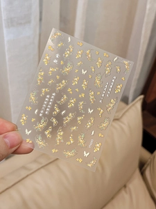 Macro detail of YT4265 5D embossed nail stickers with golden osmanthus and butterfly