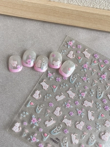 Detail of cute cat and flower nail stickers with 3D embossed texture and hand-painted style