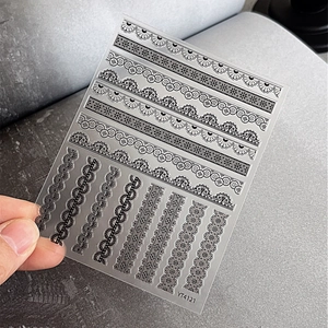 Intricate black lace nail art stickers with striped patterns and floral textures YT4121
