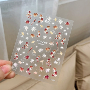 Iridescent autumn maple and ginkgo leaf nail art stickers with bird motifs and adhesive back