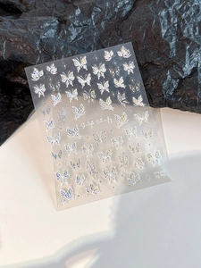 Macro detail of YT4260 holographic silver butterfly nail stickers with star accents
