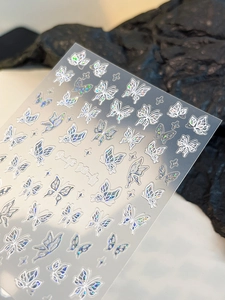 Detailed holographic laser silver butterfly nail art stickers with 3D texture and adhesive