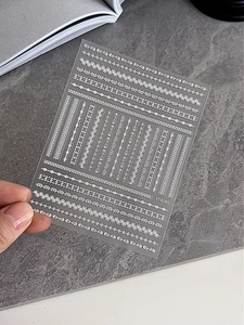 Detail of white lace embossed nail art stickers with floral and wave patterns, model YT4285