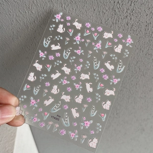 Self-adhesive nail stickers with cute white cats and pink flowers in watercolor style