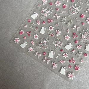 3D embossed nail art stickers with white rabbit, pink flowers, and cute strawberry motifs