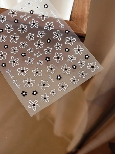 Macro view of Secret Garden YT4155 nail stickers with black and white hollow flower patterns