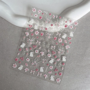 3D embossed nail art stickers featuring pink cherry blossoms and cute white rabbits
