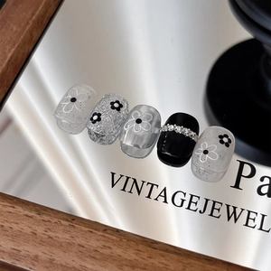Floral nail stickers with black and white hollow five-petal flower embossed patterns