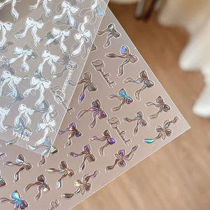Aurora ribbon bowknot nail art stickers with iridescent laser effect and cursive text