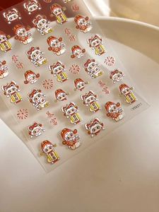 Details von 2026 Neujahrs-Nagelaufklebern mit Cartoon-Löwentanz und Goldfolien-Akzenten