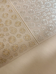 Macro detail of YT4256 3D embossed nail stickers with gold floral and firework patterns