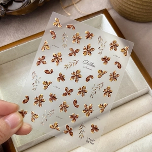 Golden embossed autumn floral nail stickers with bronze flowers and leaf patterns