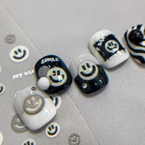 Pop art style black and white nail stickers with embossed smileys and pearl accents