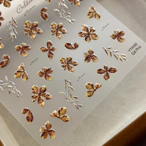 3D embossed floral nail art stickers in metallic gold and bronze for autumn style