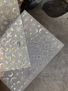 Detailed relief star and moon nail stickers in metallic gold and silver finish
