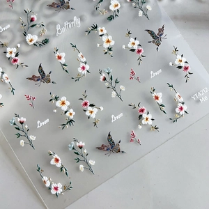 Autocollants ongles 5D gaufrés papillons dorés et marguerites avec textures en relief