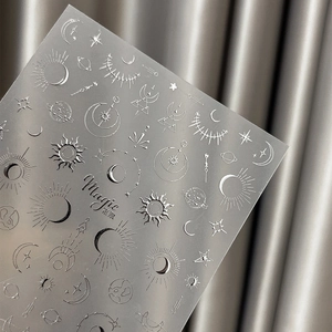 Silver 3D embossed nail art stickers with celestial sun moon and star patterns