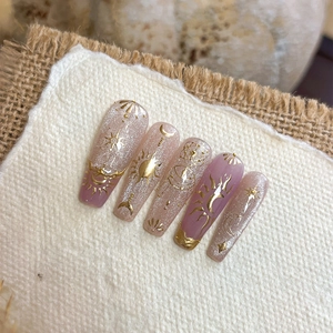 Purple gradient long coffin press-on nails with gold celestial star and moon embossing