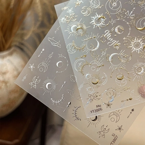 Gold and silver star moon nail stickers with celestial sun and magic text patterns