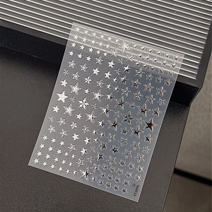 Self-adhesive silver star nail art stickers with metallic mirror finish for manicure
