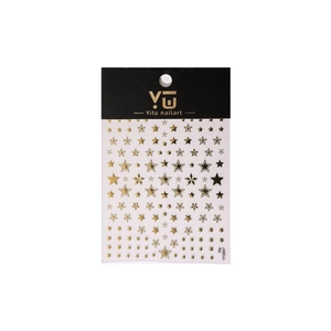 Gold star and moon nail stickers with metallic stars and grid patterns on white background