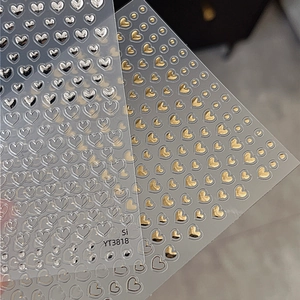Self-adhesive hollow heart nail stickers in metallic gold and silver 3D relief finish