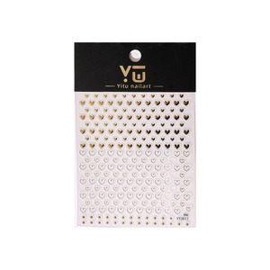 Gold and white heart nail stickers with metallic foil and hollow design on a display card