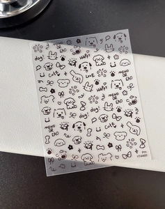Macro view of YT4468 black cartoon nail stickers featuring cute animals and flowers