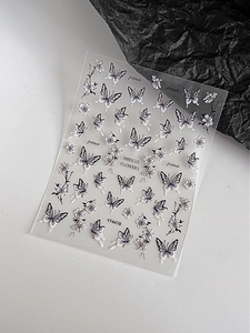 Close-up of butterfly and hibiscus flower nail stickers with YT4478 model number