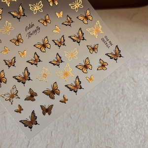 Golden butterfly nail stickers with 3D embossed texture and black shadow details YT4390