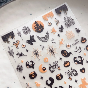 Halloween nail art stickers with ghosts, spiders, and pumpkins on self-adhesive sheets