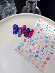 Detailed view of Jinx graffiti nail art stickers with colorful street style text and motifs