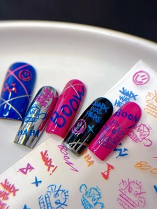 Close-up of street graffiti nail stickers with Jinx motifs and colorful line patterns