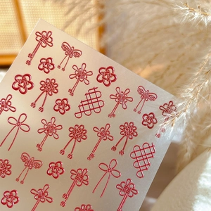 Red 3D embossed nail art stickers with traditional Chinese knots and镂空 designs