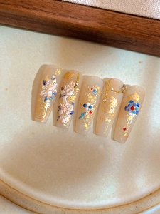 Detail of 3D embossed peony nail stickers with gold foil and Fu characters