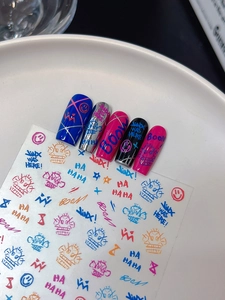 Macro view of street graffiti nail art stickers with Jinx inspired patterns and text