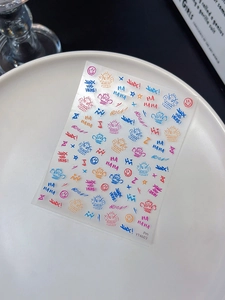 Close-up of colorful graffiti nail stickers featuring Jinx theme with BOOM! text