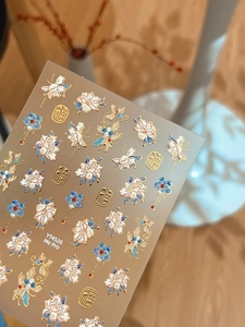 Detailed relief texture of peony floral nail stickers with gold embossed accents and Fu character