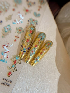 Macro detail of YT4378 gold lotus nail stickers with Chinese enamel pattern style