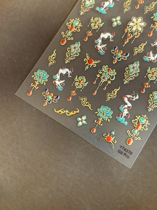 Macro view of 5D embossed Chinese style nail stickers with gold lotus and cloud patterns