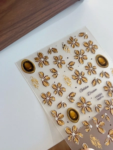 Detail of YT4583 3D embossed gold flower nail stickers with metallic relief texture