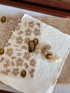 Detail of Golden Dream YT4583 embossed nail stickers with vintage flower and leaf patterns