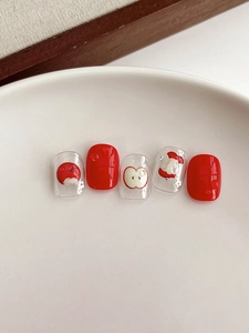 Détails de faux ongles aux motifs de pommes rouges avec effets gouttes d'eau 3D