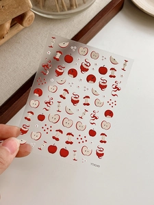 Vue détaillée d'autocollants 3D mignons pour ongles, motifs pomme et fleurs avec adhésif