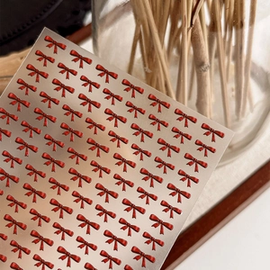 3D embossed red bow nail art stickers with metallic finish for DIY manicure decoration